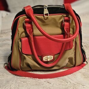 Orange, blue,and tan Steve Madden purse with orange handles and removable strap